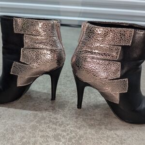 Michael Antonio rose gold accents on black bootie